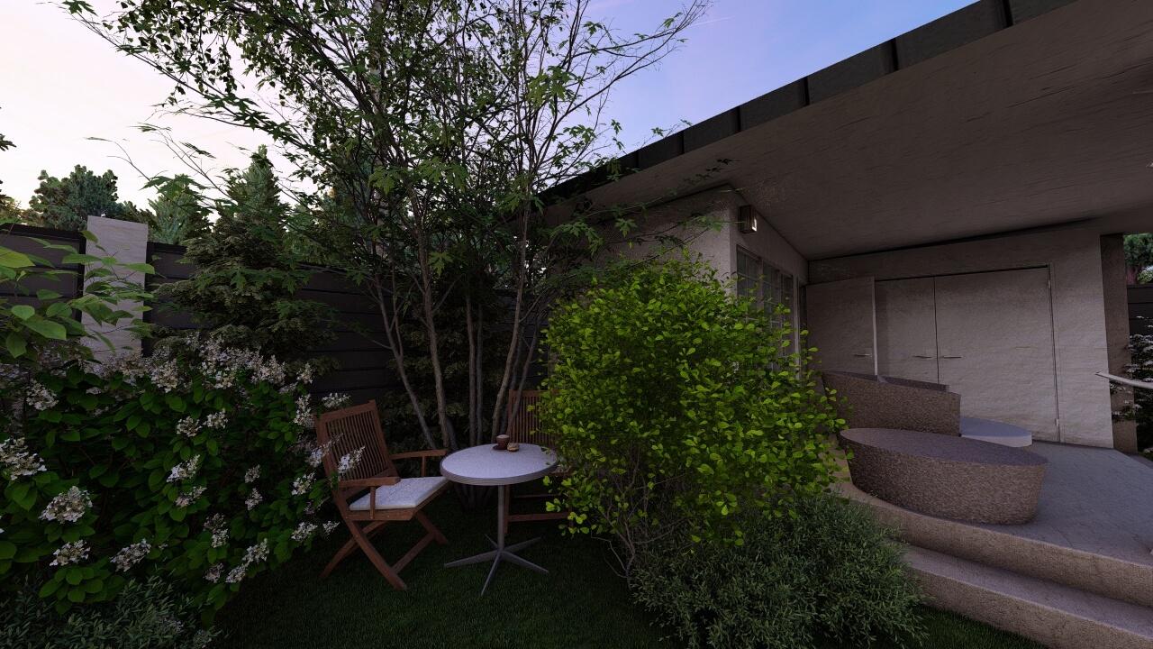 Уютный уголок в саду со столиком для завтраков в окружении зелени